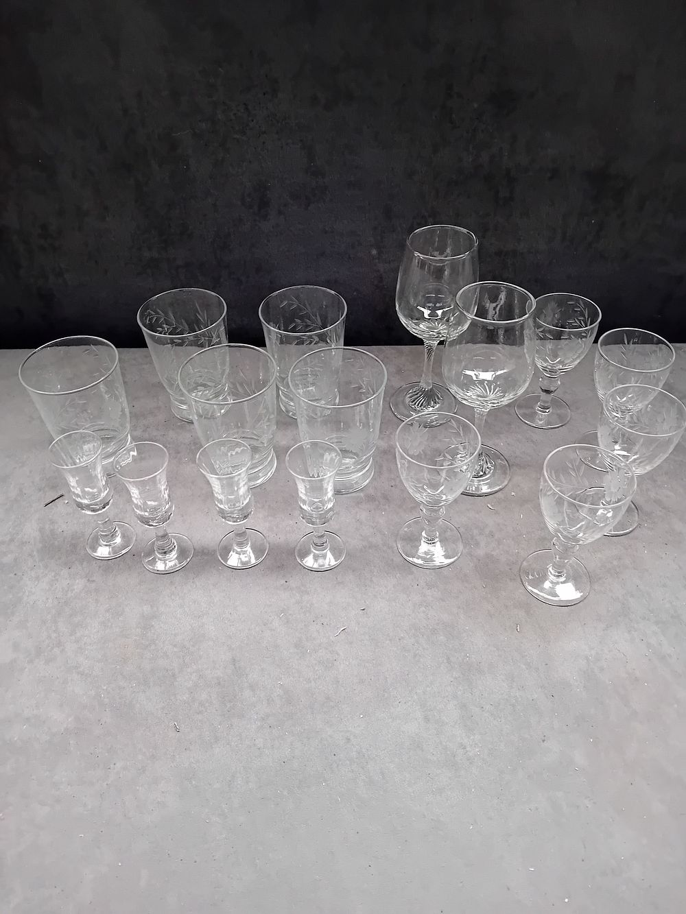 Lot 184: A Collection of 16 Clear Etched Glassware Pieces