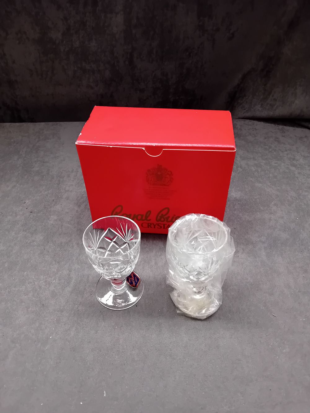Lot 349: A Pair of Royal Brierley Crystal 'Cross and Olive' Sherry Glasses, By Appointment to Her Majesty The Queen