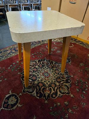 A set of 4 modern dining tables, each featuring a rounded corner square top with a durable 