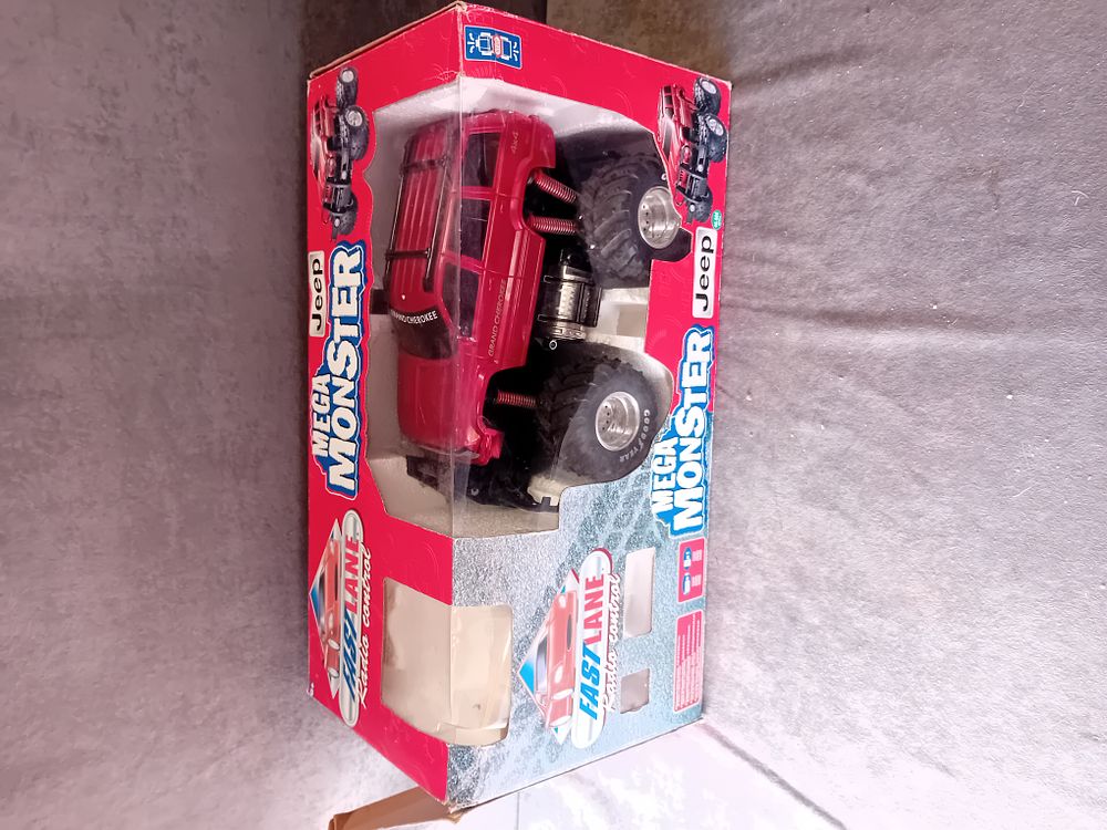 Lot 713: FAST LANE MEGA MONSTER JEEP GRAND CHEROKEE RC TRUCK