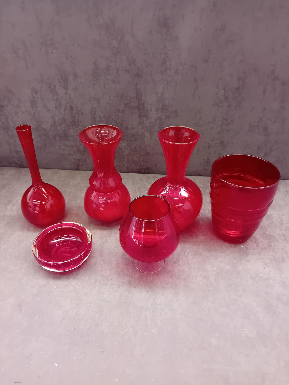 Lot 387: A Set of Six 1960s Ruby Red Glass Decorative Objects