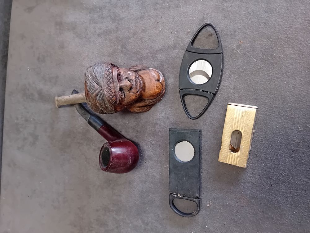 Lot 308: A Collection of Tobacco Pipes and Cigar Cutters