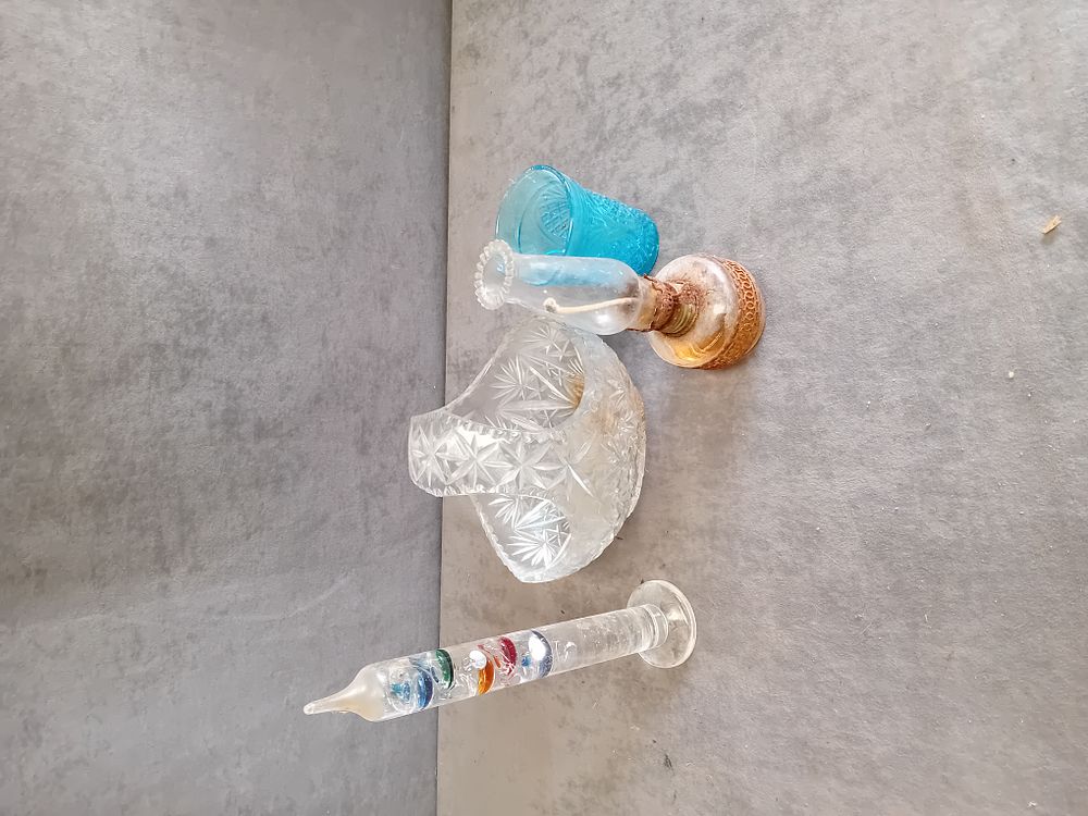 Lot 317: An Assortment of Decorative Glassware Including a Galileo Thermometer and Miniature Oil Lamp