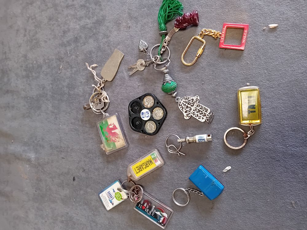 Lot 319: An Assortment of Souvenir, Promotional, and Decorative Keychains and Fobs