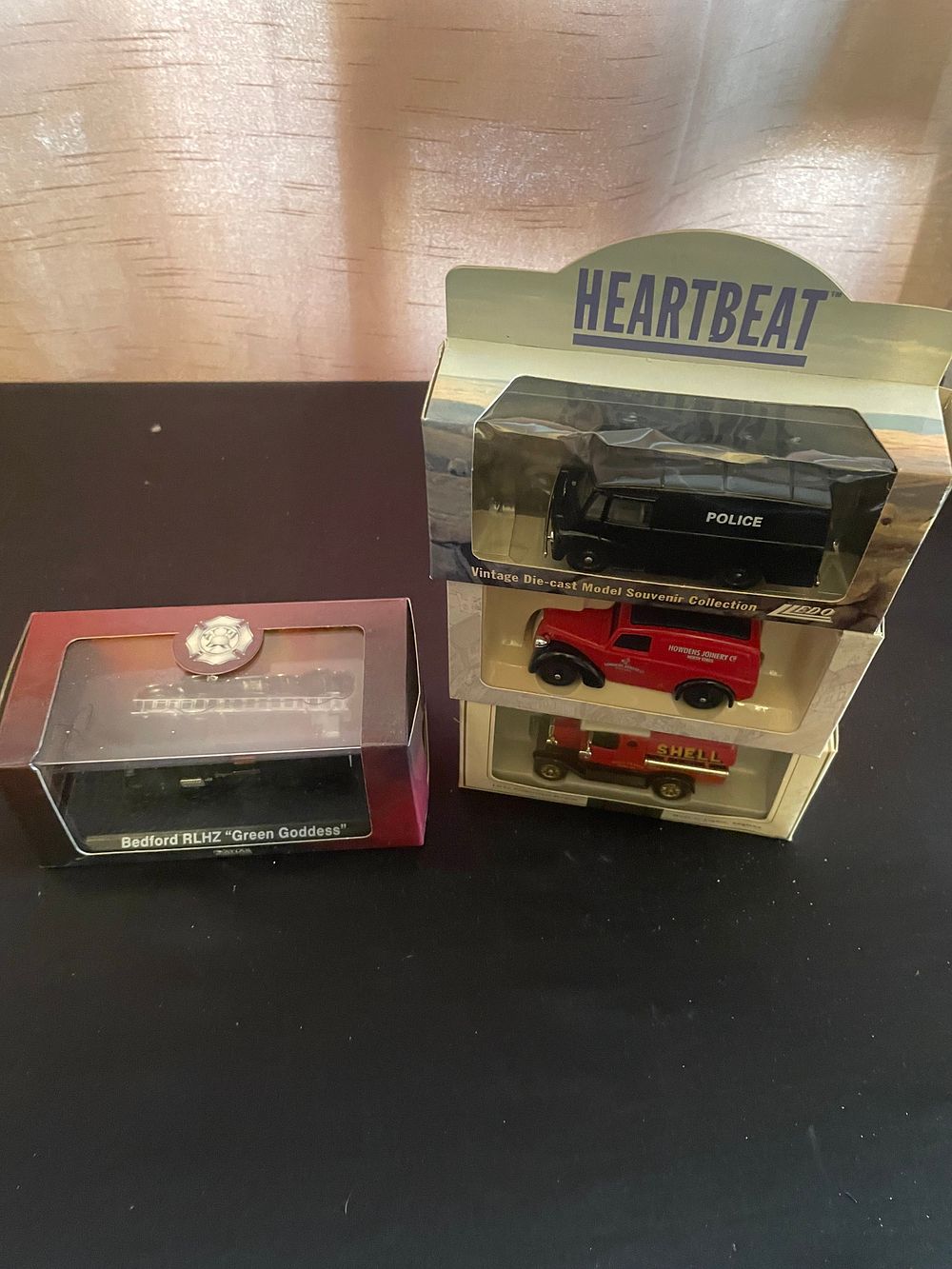 Lot 327: A Group of Four Die-Cast Classic Vehicles by Lledo and Ordnance Atlas Collections