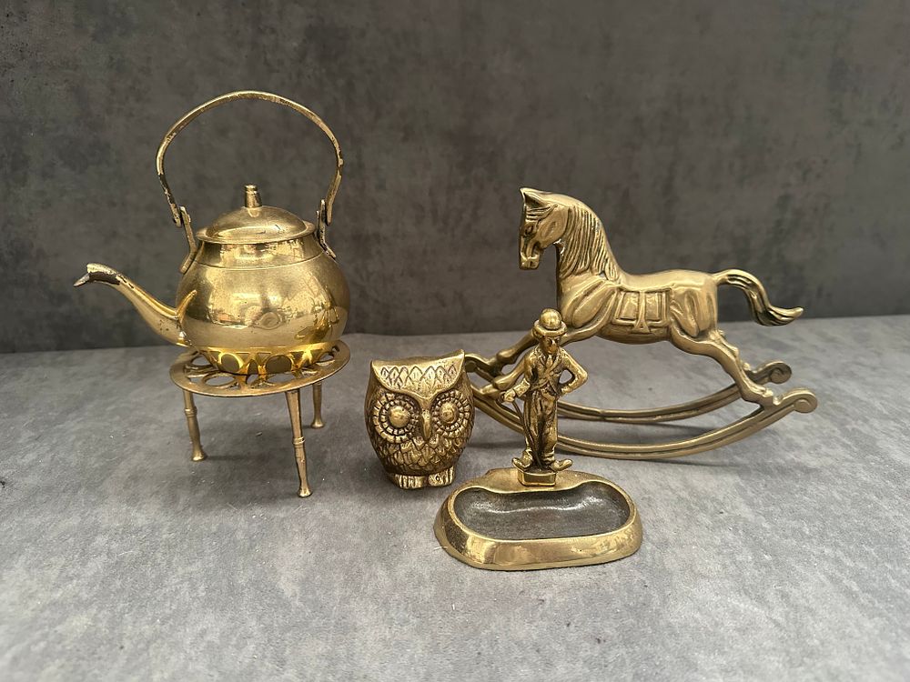Lot 581: A Group of Four Brass Decorative Miniatures, including a Rocking Horse