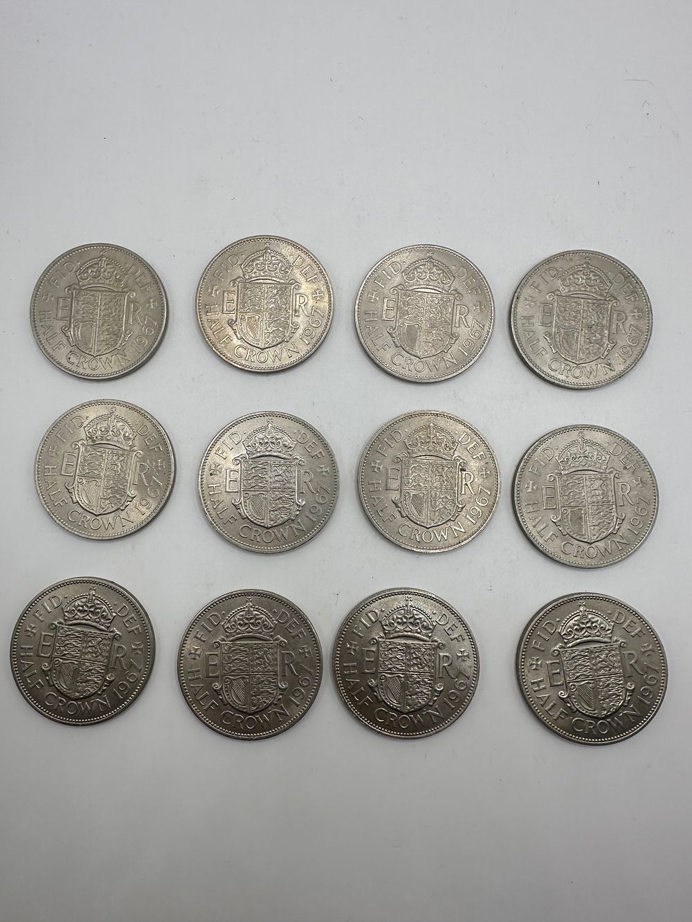 Lot 430: A Collection of 12 British Half Crown Coins, Elizabeth II