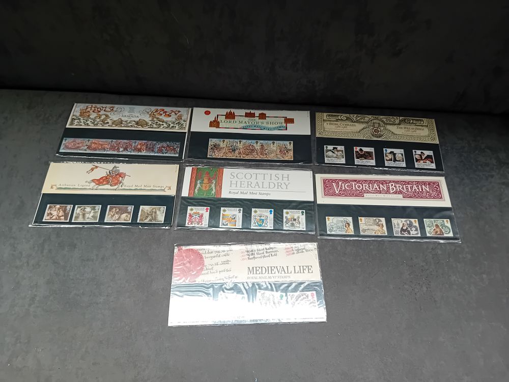 Lot 601: Lot of 7 Historical Themed Stamp Presentation packs...