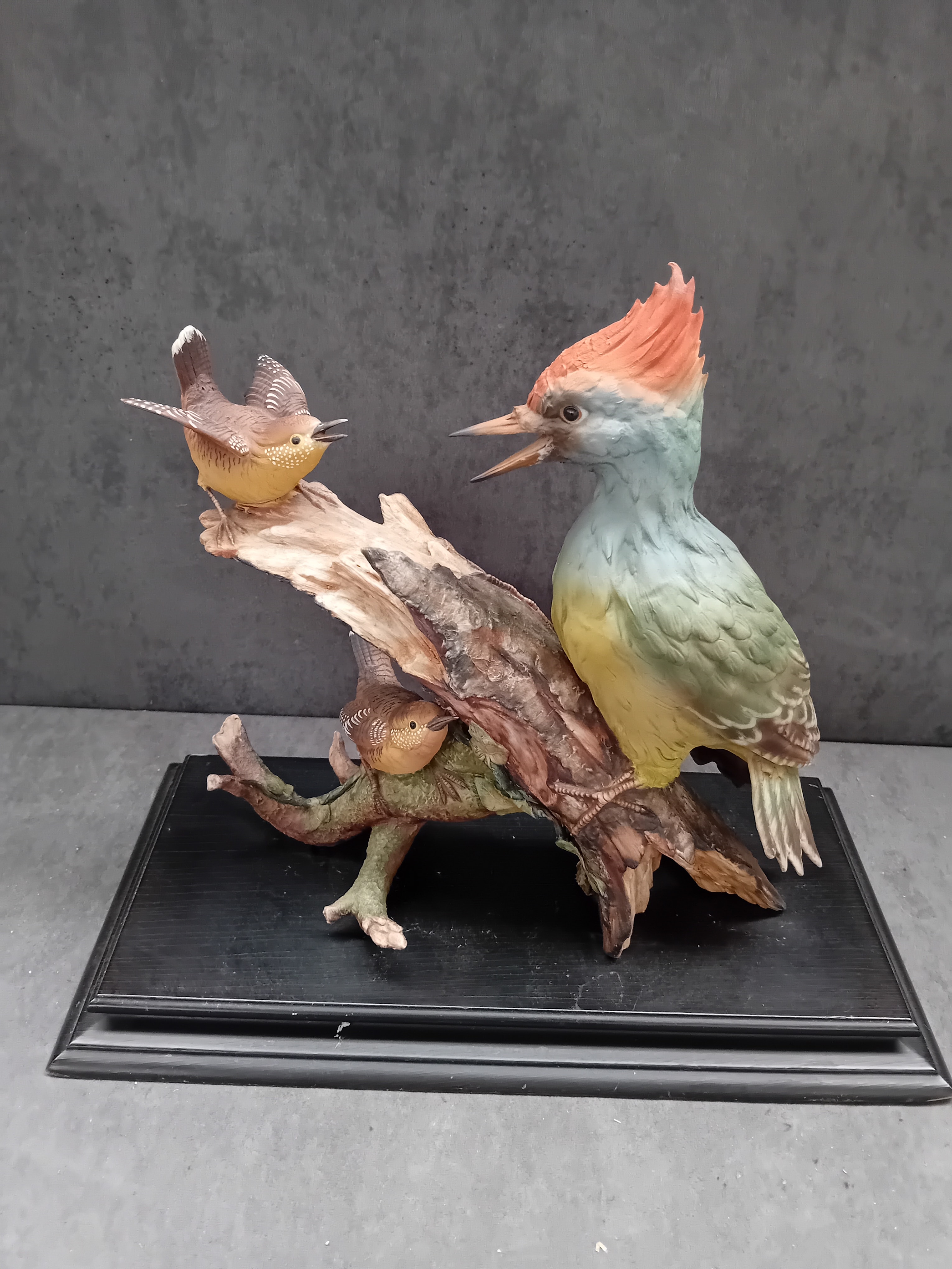 A Naturalistic Chinaware Figurine of Three Birds on a Branch