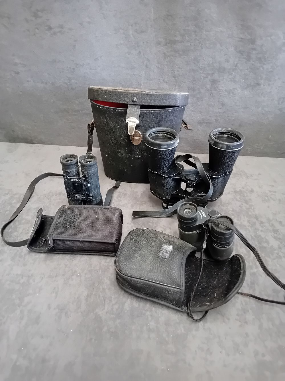 Lot 439: A Trio of Binoculars by Boots, Sunagor, and Tronic with Carrying Cases
