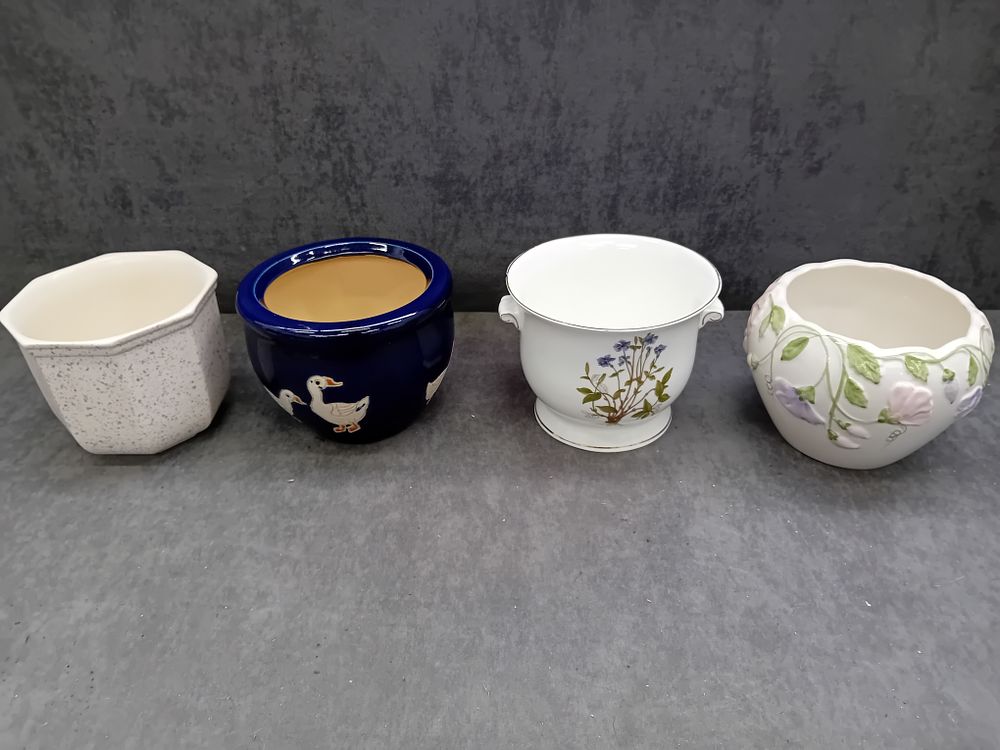 Lot 99: A Group of Four Ceramic Planters, including a Portmeirion 'The Queen's Hidden Garden' Bone China Jardiniere