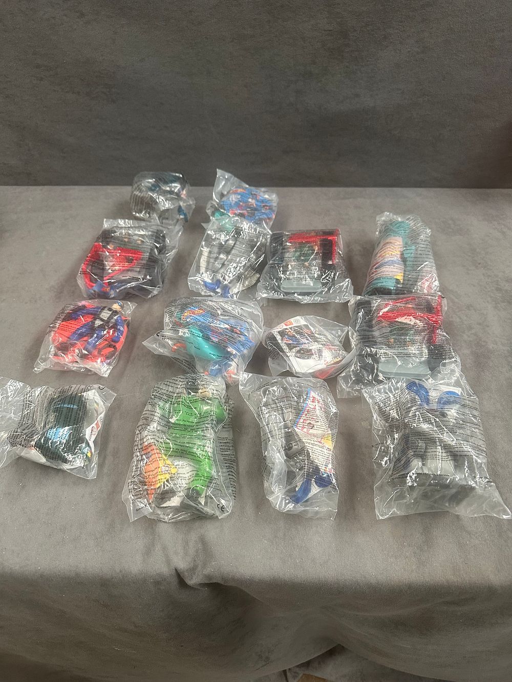 Lot 231: A Collection of 14 Vintage McDonald's Happy Meal Toys featuring Action Man and Hot Wheels