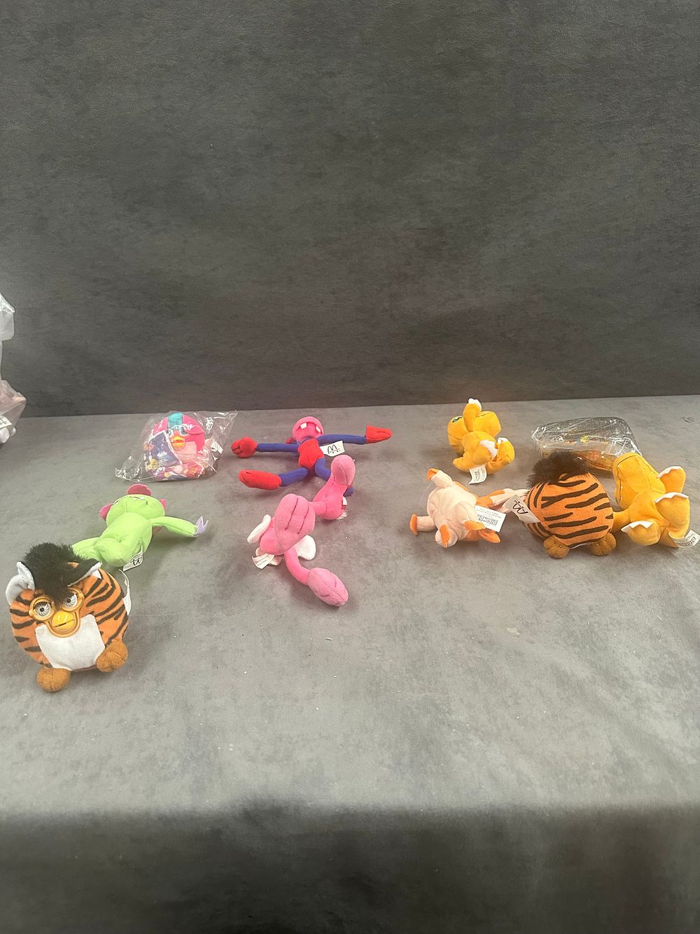 Lot 232: An Assortment of McDonald's Happy Meal Plush and Plastic Promotional Toys