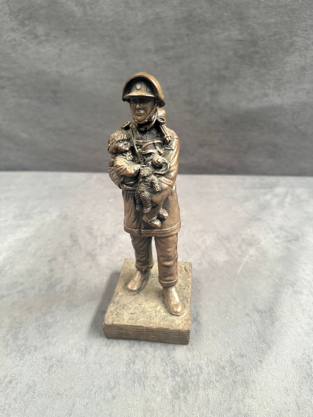 Lot 744: Firefighter Search and Rescue Figurine with Child and Dog Resin - Bronze effect