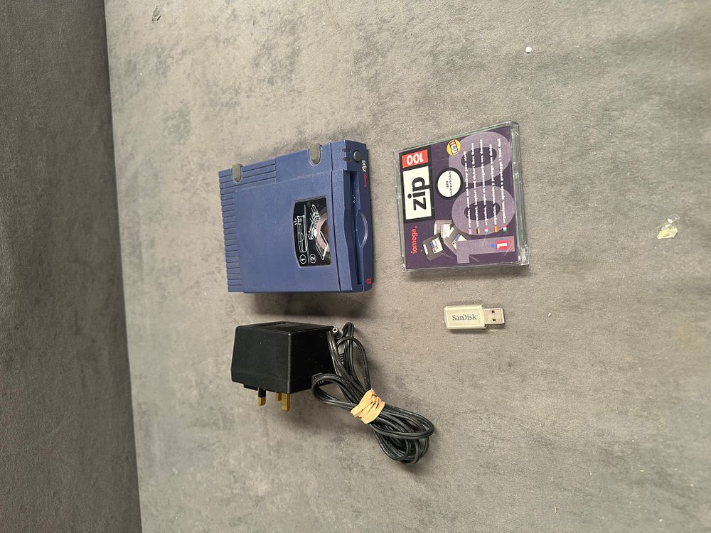 Lot 766: An Assortment of Vintage Computer Peripherals and Data Storage Media including an Iomega Zip 100 Drive