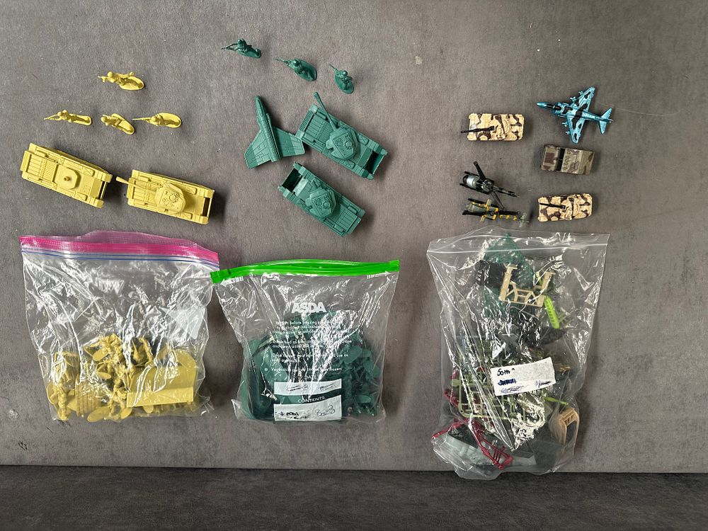 Lot 255: An Assortment of Plastic and Die-Cast Military-Themed Toys and Battlefield Accessories