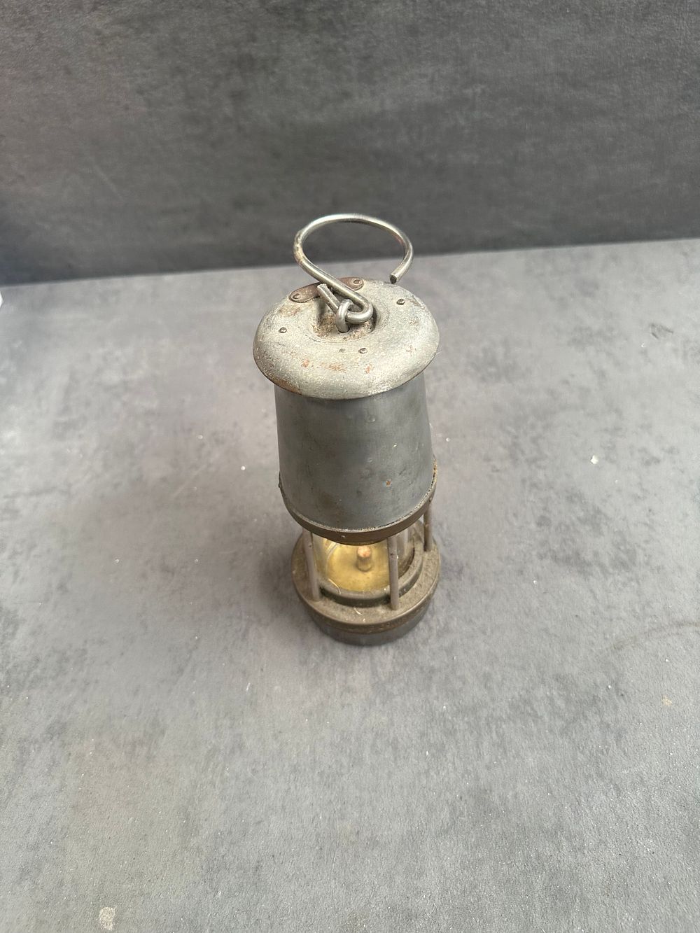 Lot 783: An early 20th century miners safety lamp in brass and steel