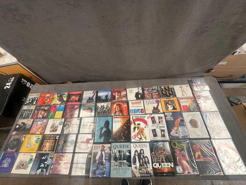 Lot 415: A Collection of Approximately 80 Queen and Freddie Mercury CDs and DVDs