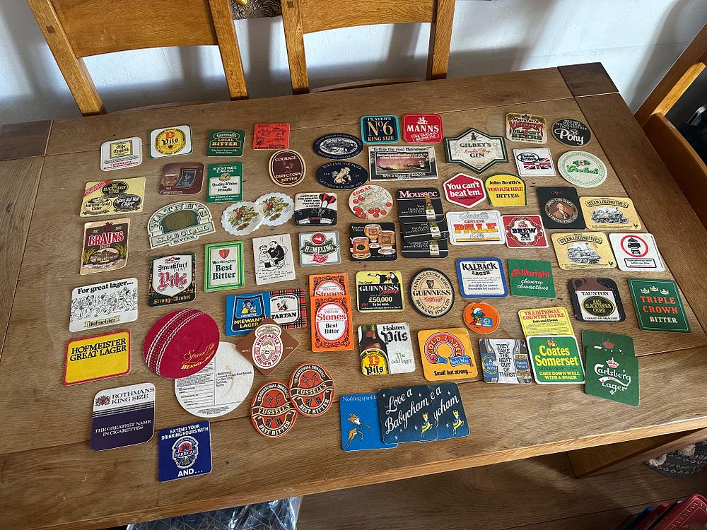 Lot 455: A Collection of Vintage British and International Beer Mats and Pub Advertising Ephemera