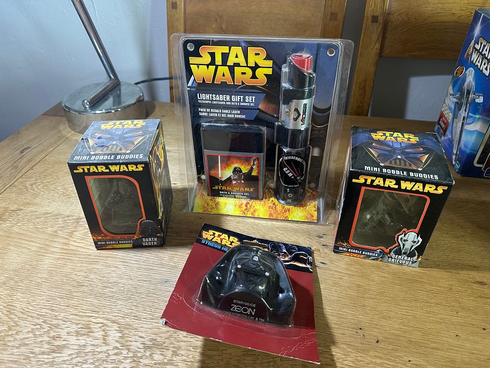 Lot 209: A Collection of Four Star Wars Darth Vader and General Grievous Character Collectibles and Gift Sets