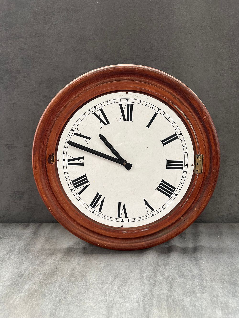 Lot 667: An Early 20th Century Stained Mahogany Circular Dial Wall Clock
