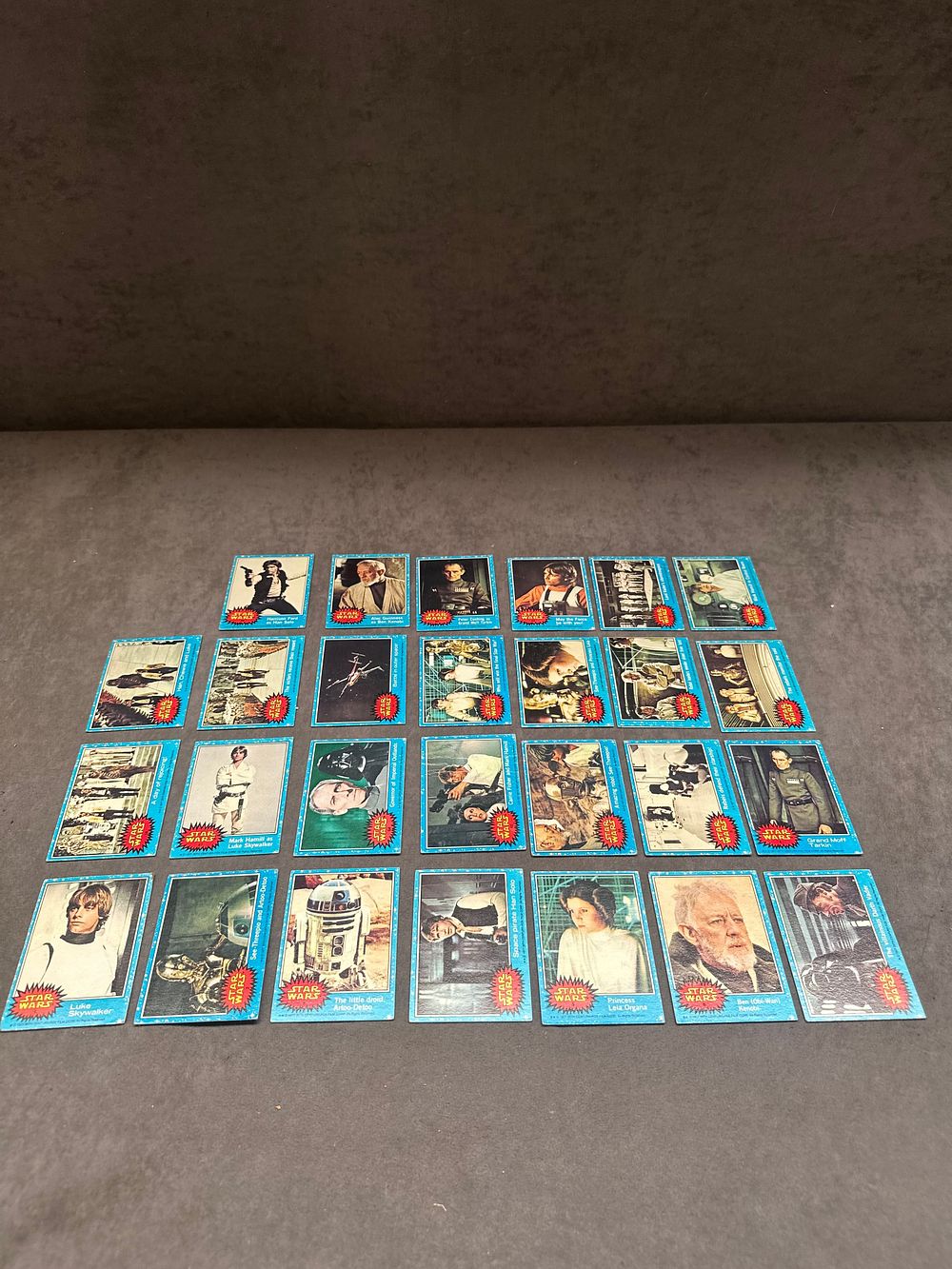 Lot 21: A Collection of 28 Topps 1977 Star Wars Series 1 Blue Border Trading Cards