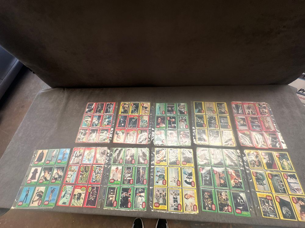 Lot 22: A Collection of 1977 Topps Star Wars Trading Cards Series 2 Red Series 3 Yellow and Series 4 Green
