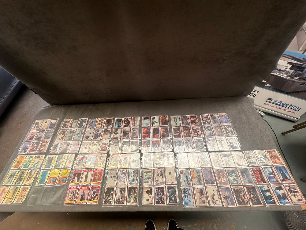Lot 24: A Collection of Vintage Topps Star Wars The Empire Strikes Back Trading Cards