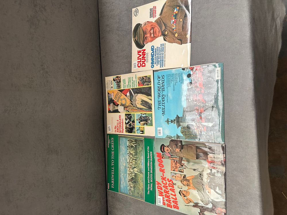 Lot 494: A collection of five vintage 12-inch vinyl LP records featuring military bands and vocal performances