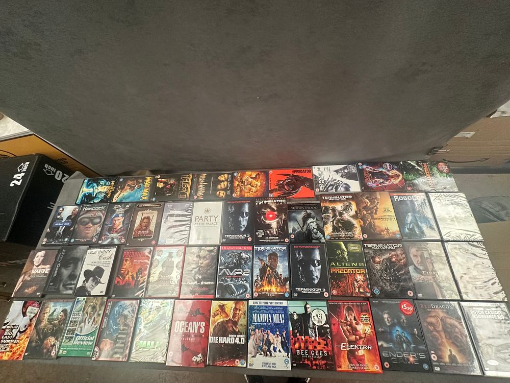Lot 688: A Collection of approx 60 DVDs Including Action, Sci-Fi, and Music Titles