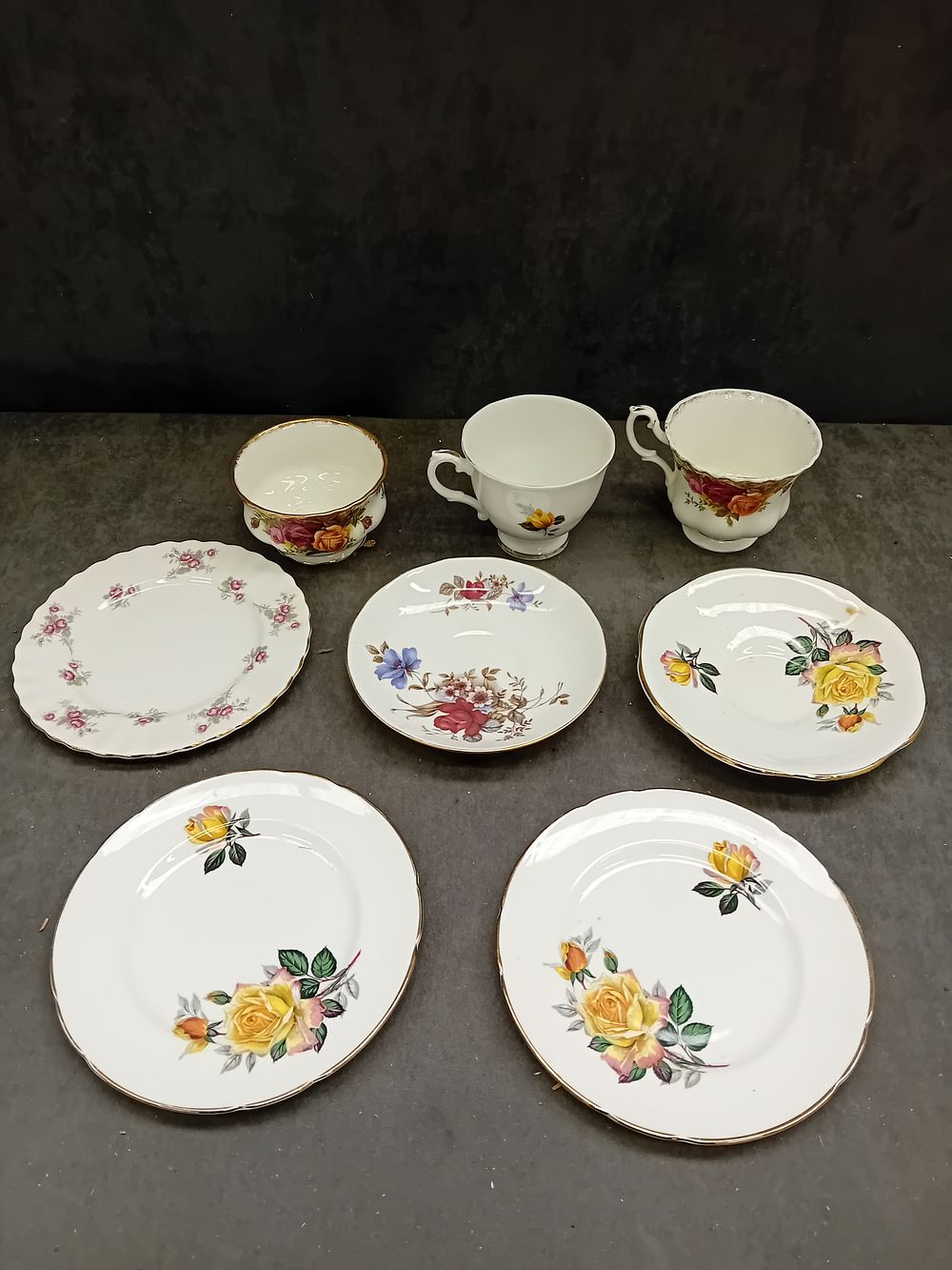 Lot 731: A Collection of English Polychrome Floral Decorated Bone China Tableware