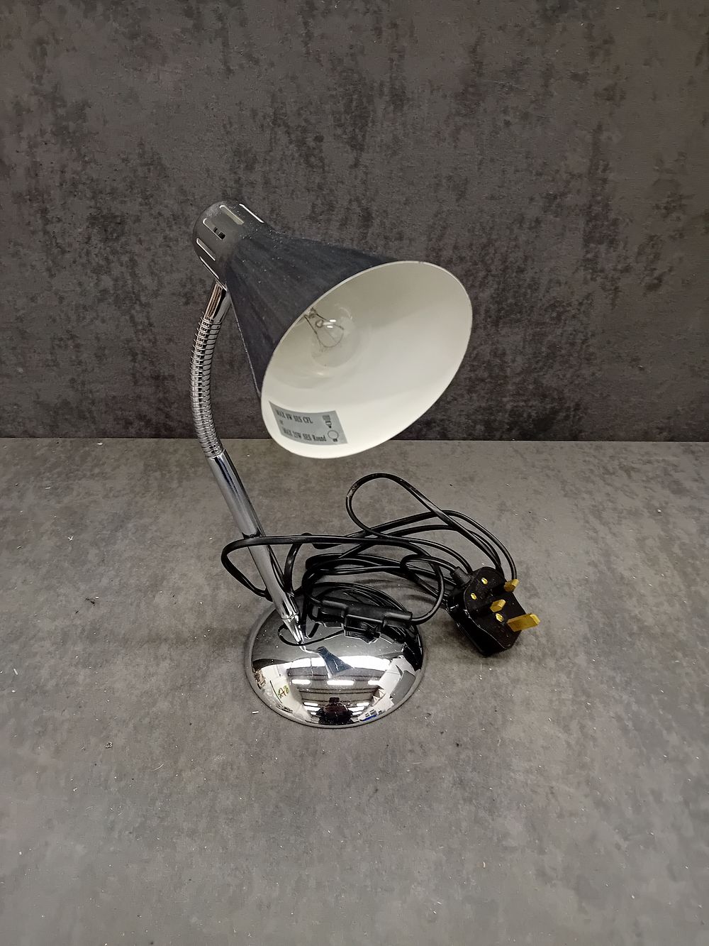 Lot 738: Asda TM1914-CH Chrome-Plated and Black Flexible Desk Lamp, dated 2010
