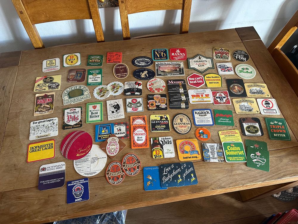 Lot 520: A Collection of Vintage British and International Beer Mats and Pub Advertising Ephemera
