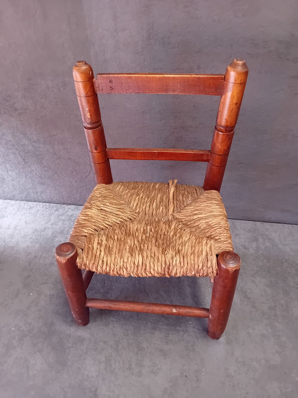Lot 556: MEXICAN FOLK ART CHILD'S WOOD CHAIR WITH RUSH SEAT
