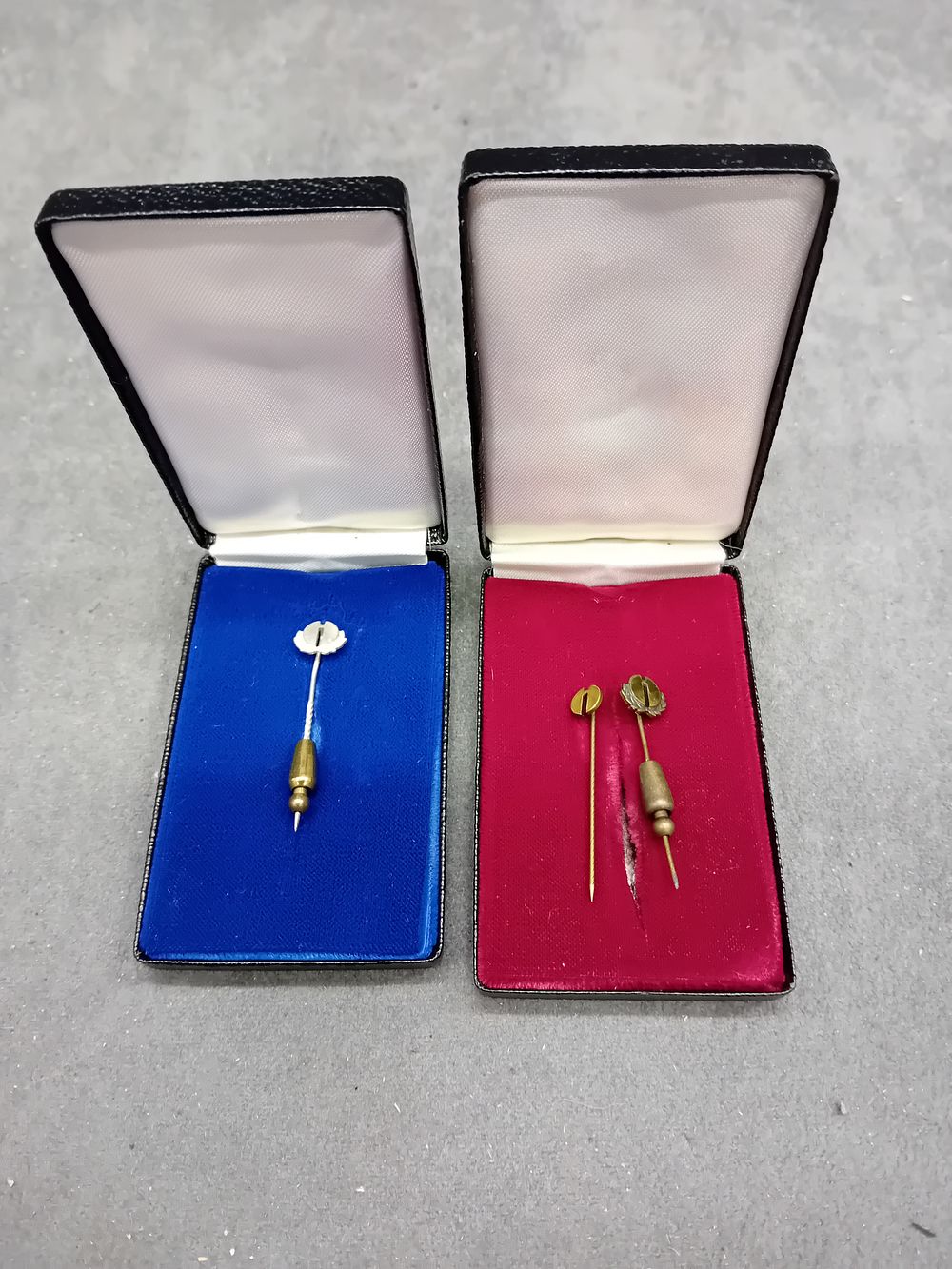 Lot 575: A Group of Three Antique Gold-Toned Stick Pins in Two Cases