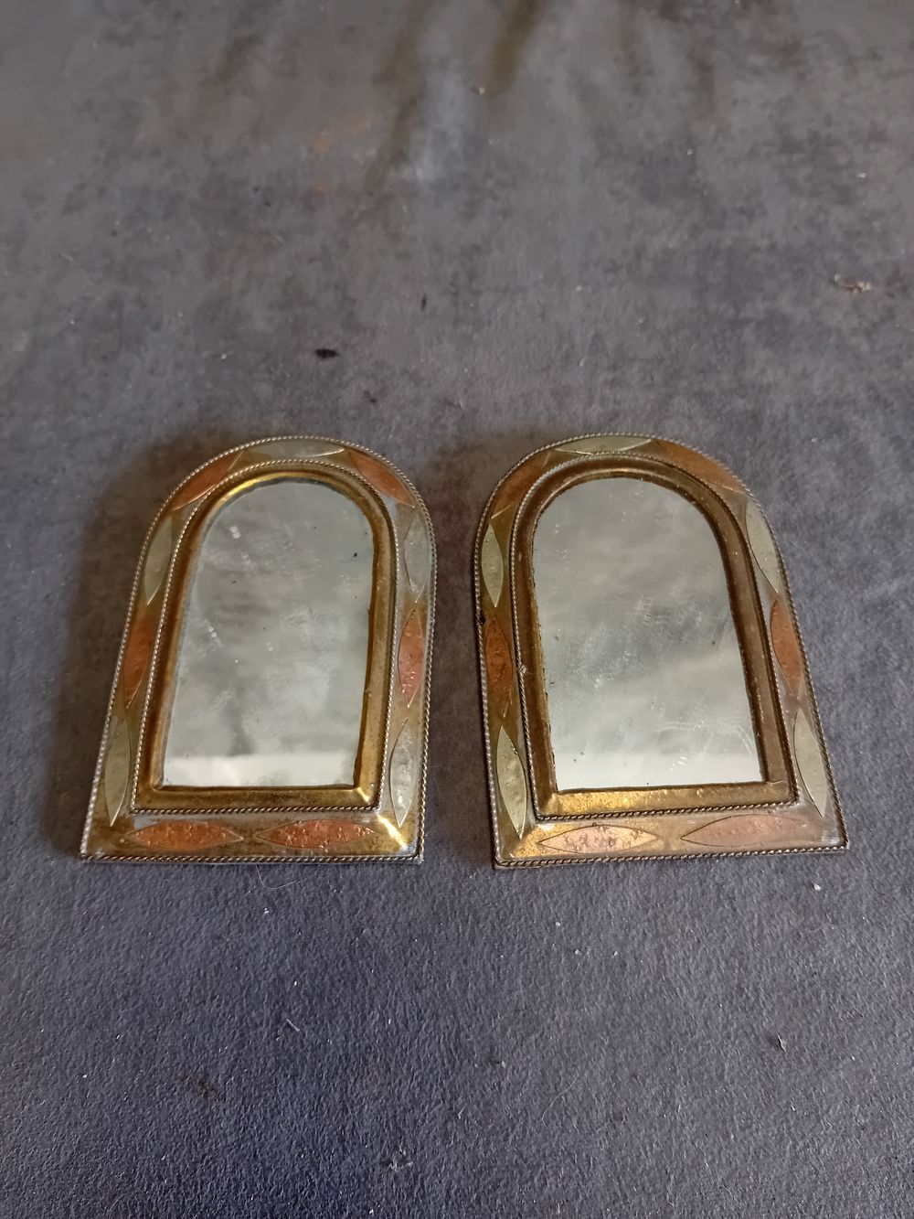 Lot 503: A Pair of Moroccan Style Mixed Metal Arched Wall Mirrors