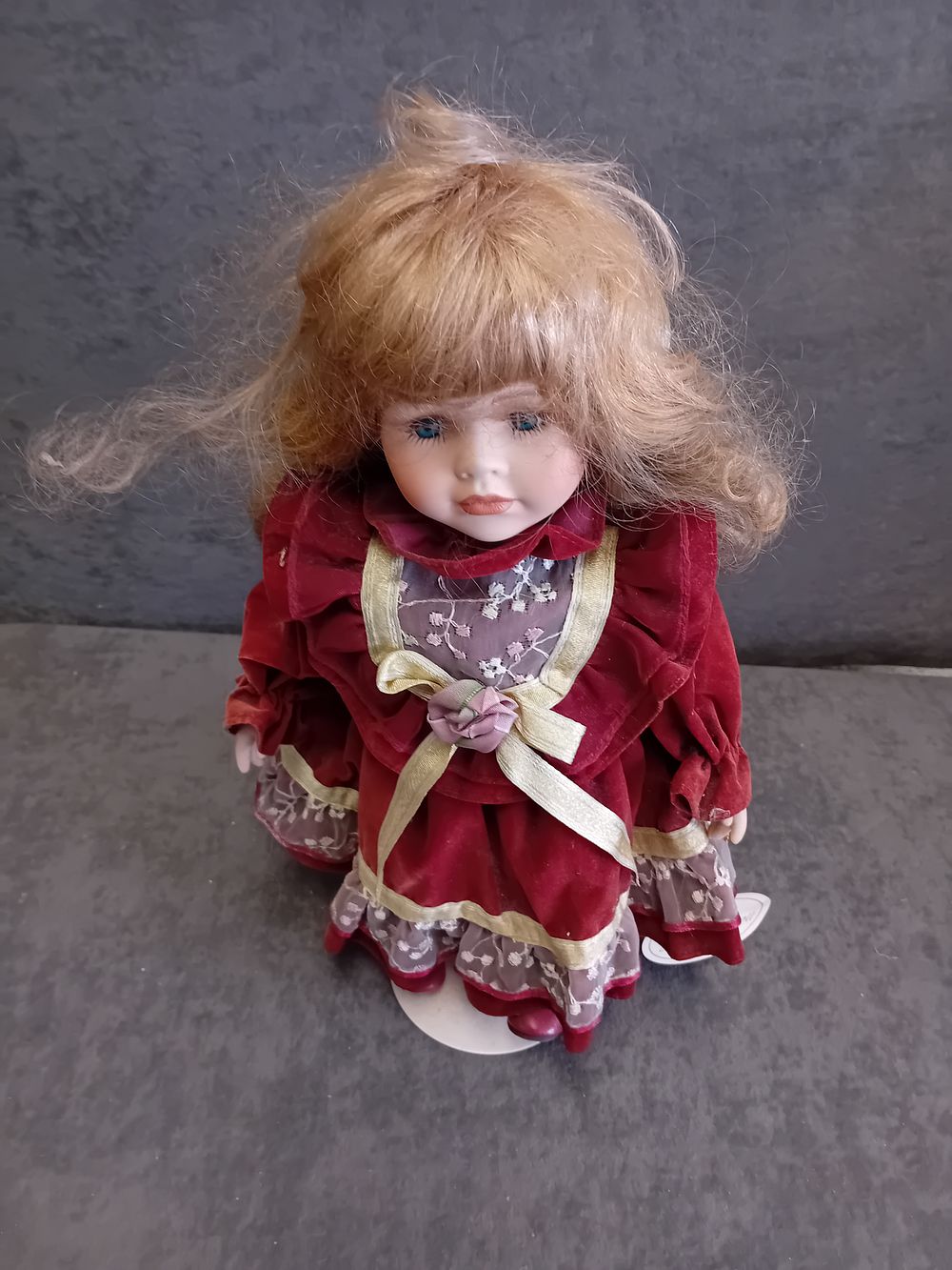 Lot 505: Leonardo Collector's Porcelain Doll in Red Velvet Style Dress