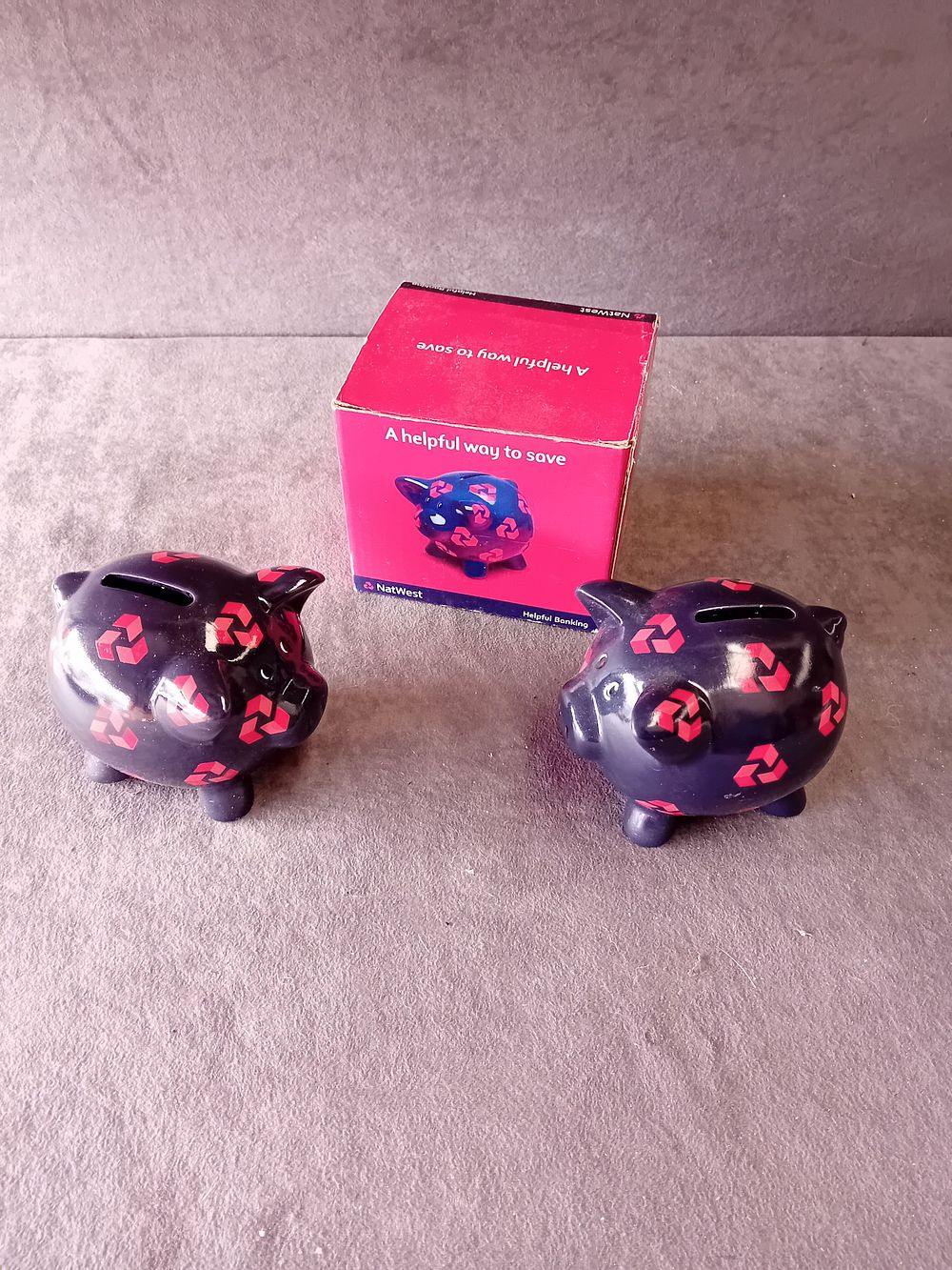 Lot 508: A PAIR OF NATWEST CERAMIC PIGGY BANKS WITH BOX