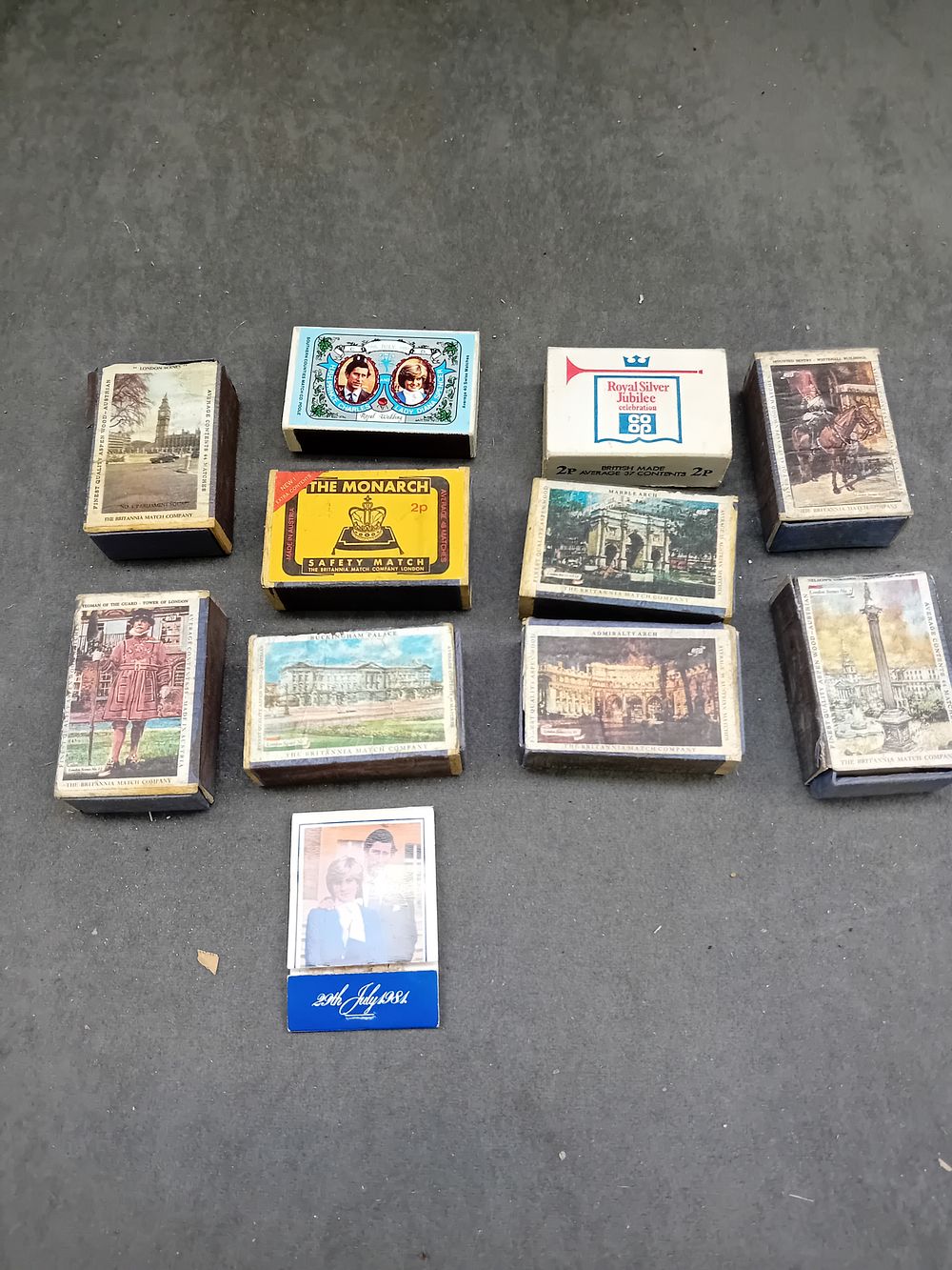Lot 519: A Collection of Eleven Vintage British Matchboxes and One Commemorative Booklet, Mid-to-Late 20th Century, Royal and Landmark Themes