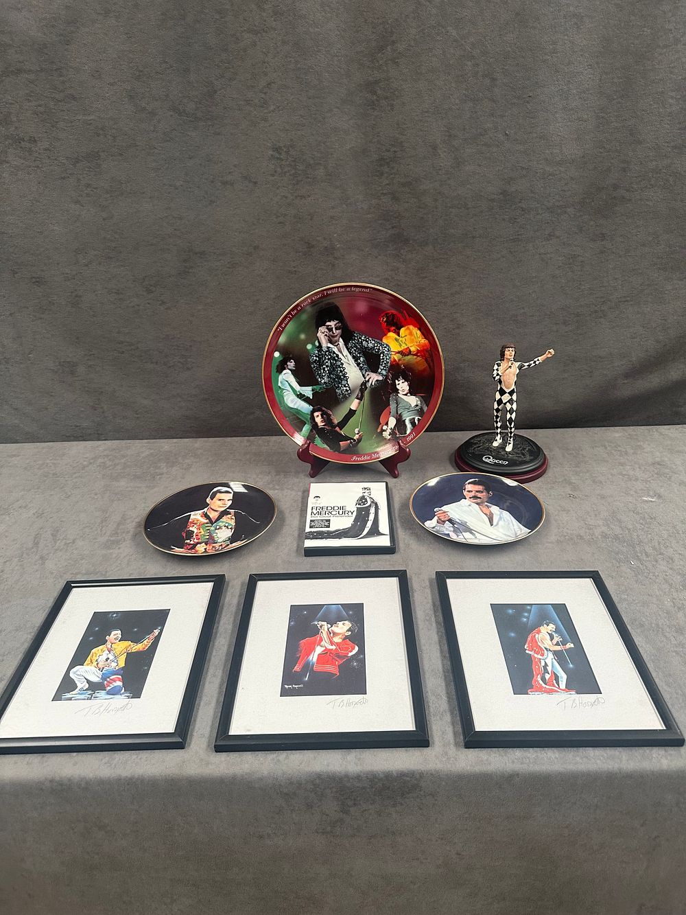 Lot 647: An Assortment of Freddie Mercury and Queen Commemorative Memorabilia including Framed Prints and Collectibles