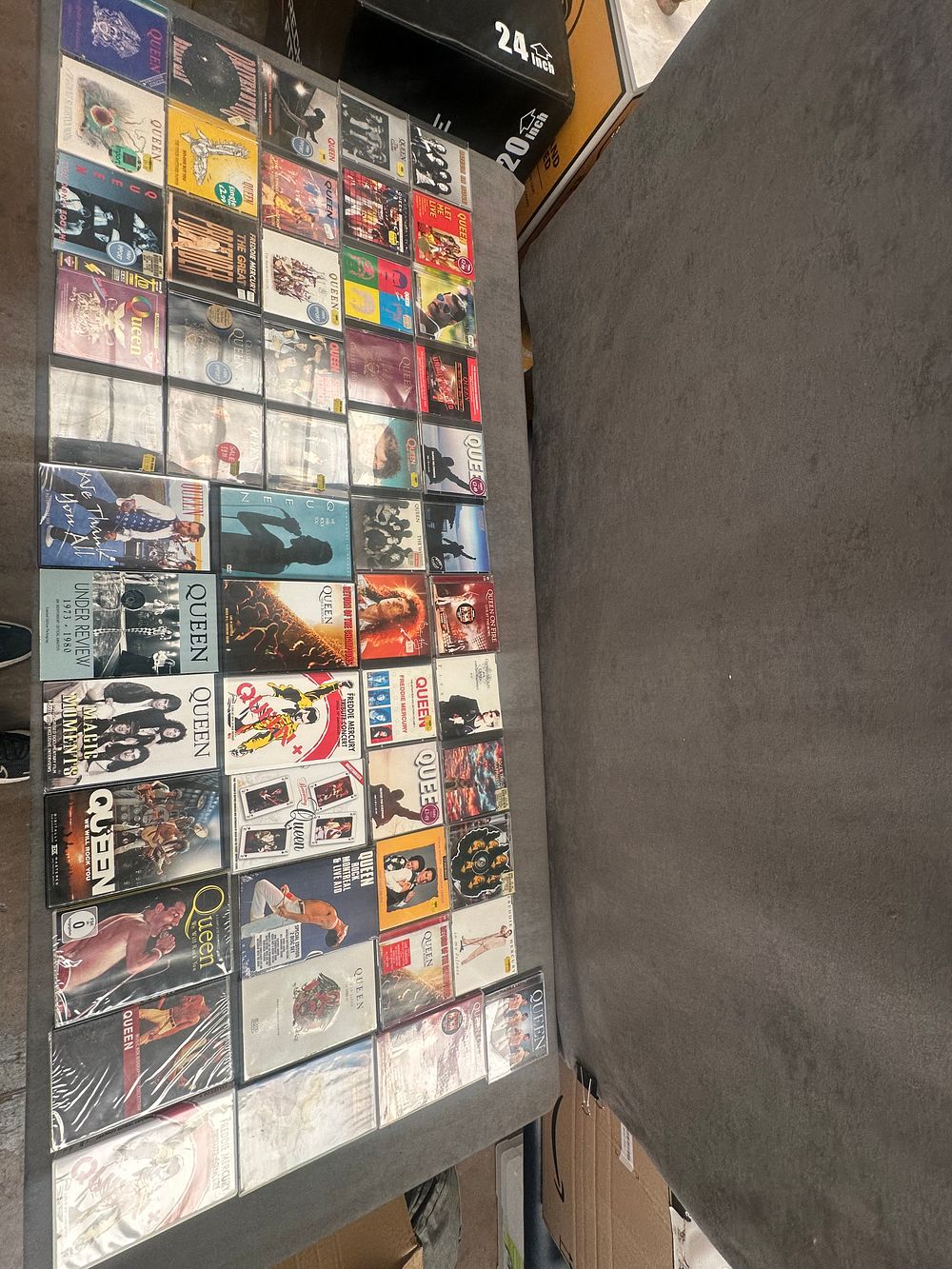 Lot 483: A Collection of Approximately 80 Queen and Freddie Mercury CDs and DVDs