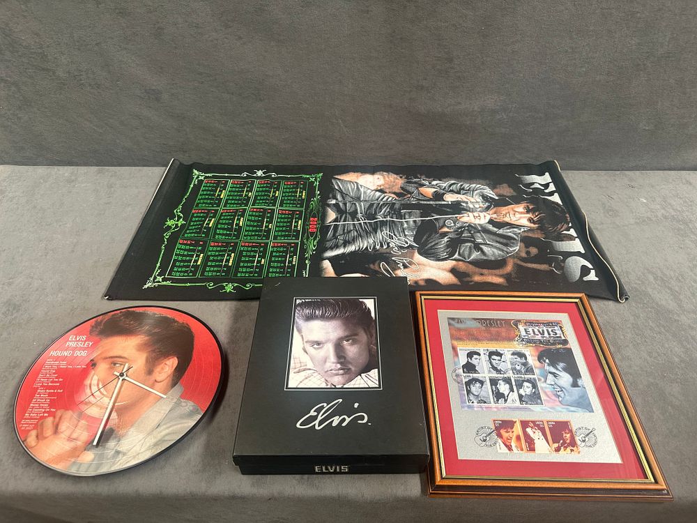 Lot 652: A Collection of Elvis Presley Memorabilia including Commemorative Stamps, a Boxed Set, a Wall Clock, and a 2008 Fabric Calendar
