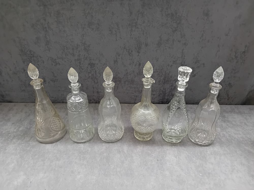 Lot 669: Six Clear Glass Decanters with Stoppers