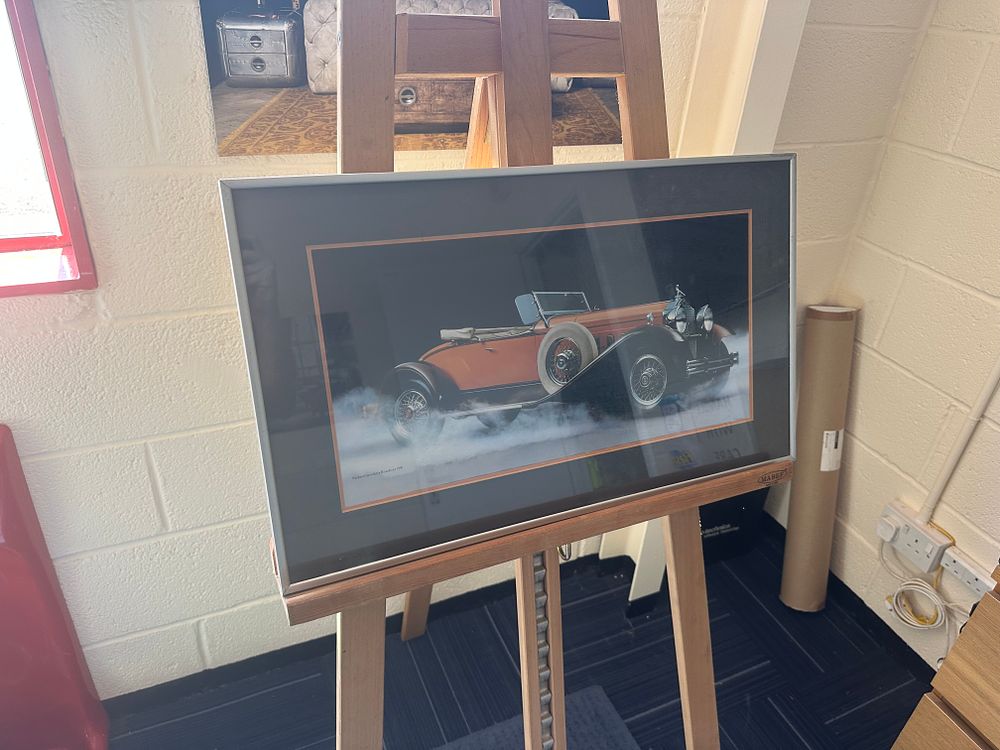 Lot 357: A Framed Colour Photograph of a 1930 Packard Speedster Runabout