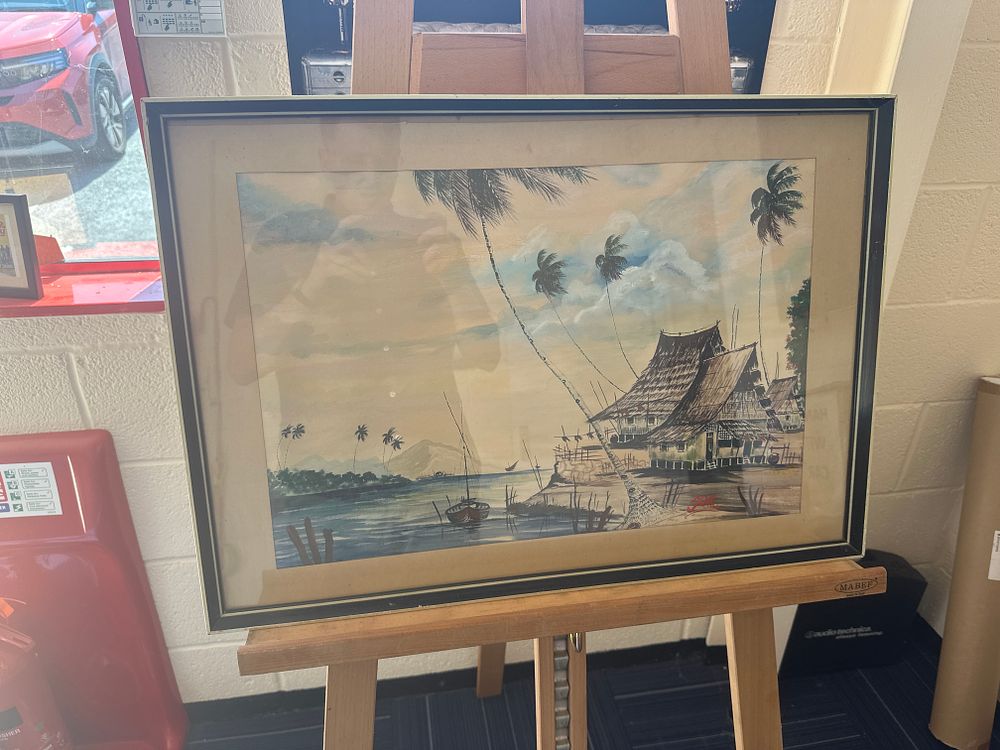 Lot 359: Zenal (20th Century), Coastal Village Scene with Palm Trees and Stilted Dwellings