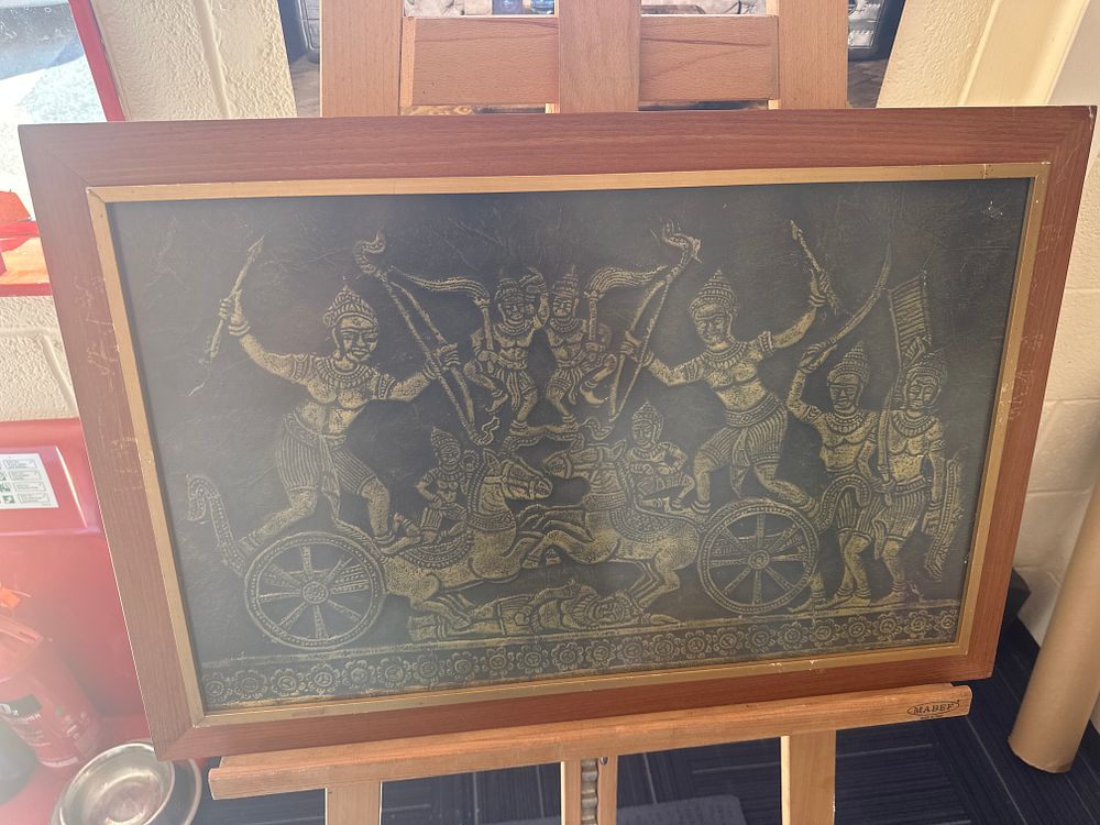 Lot 361: A Large Framed Southeast Asian Relief Panel Depicting a Mythological Battle Scene