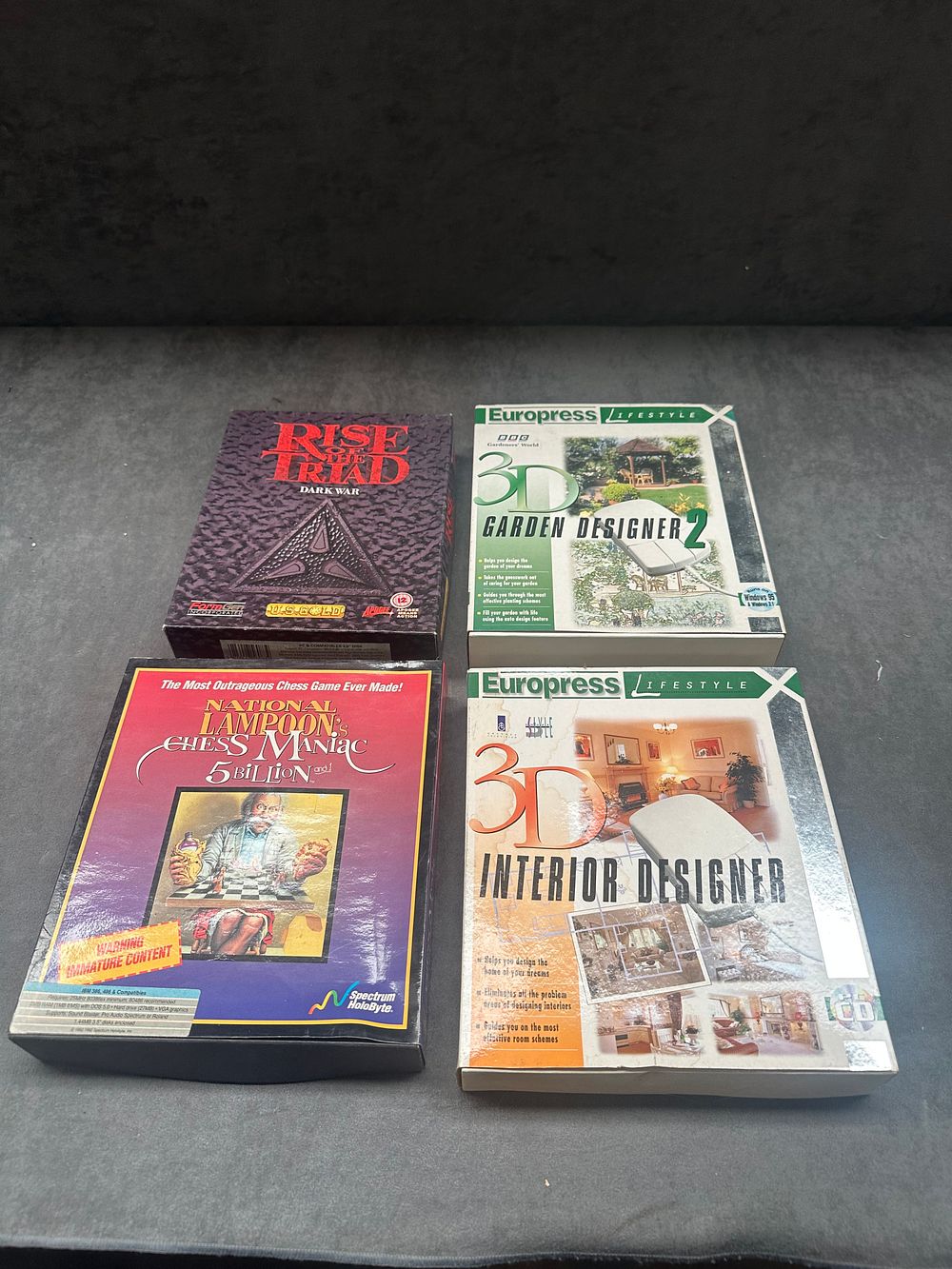 Lot 11: A Collection of Four Vintage Big Box PC Software Titles including Rise of the Triad and National Lampoon
