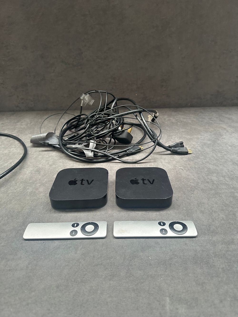Lot 489: A Collection of Apple TV Digital Media Players and Associated Accessories