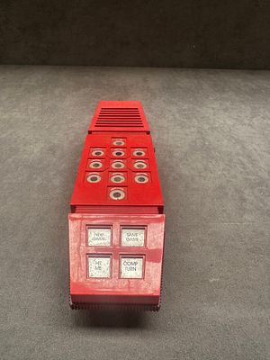 Vintage Parker Brothers Merlin Handheld Electronic Game. A vintage red moulded plastic handheld 