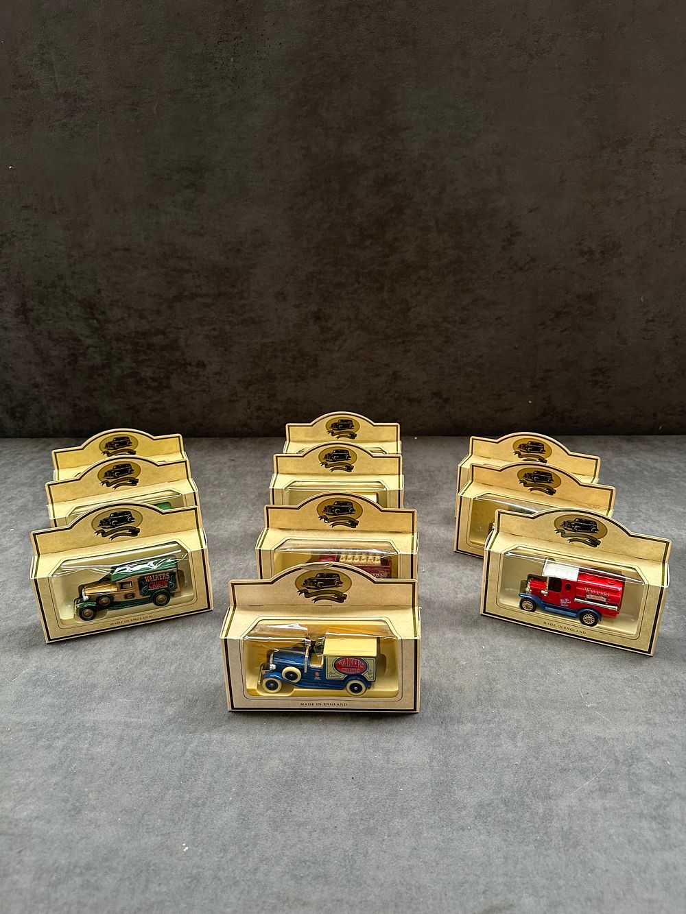 Lot 129: A Collection of Nine Lledo Promotional Die-Cast Model Delivery Vehicles for Walkers Crisps